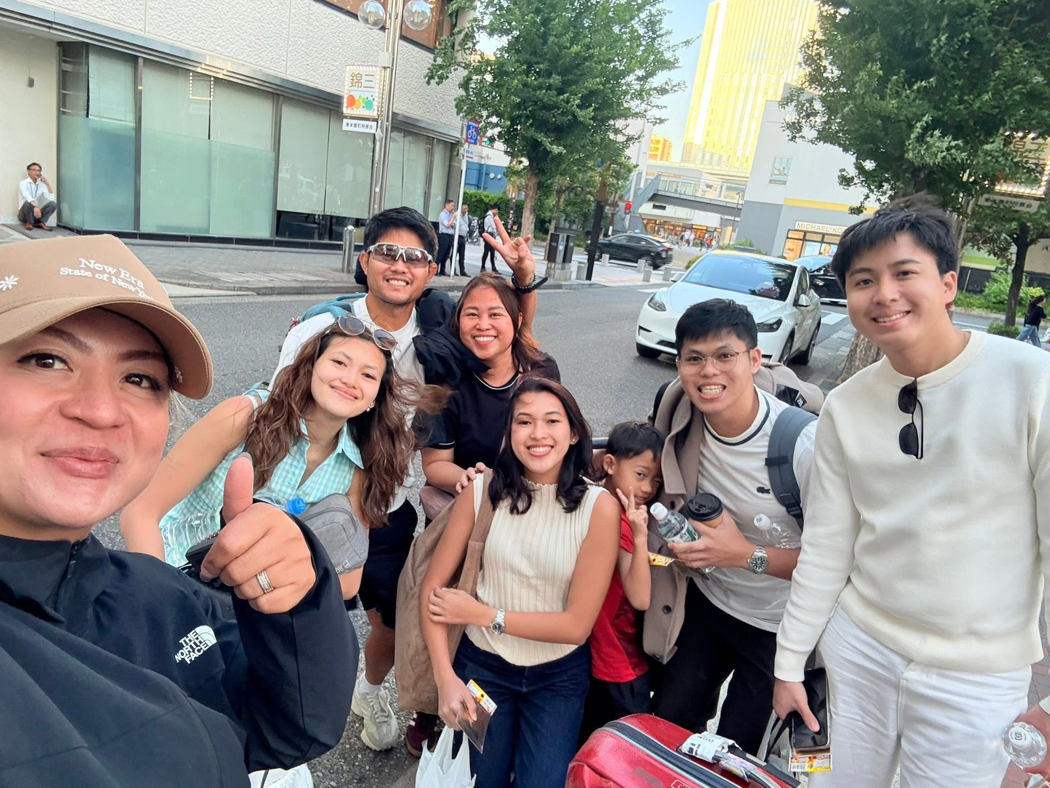 GG with travelers on a city street in Japan